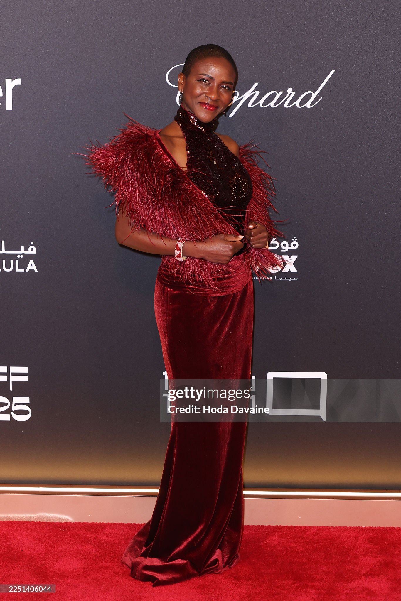 Burgundy sequin velvet gown with fur cape