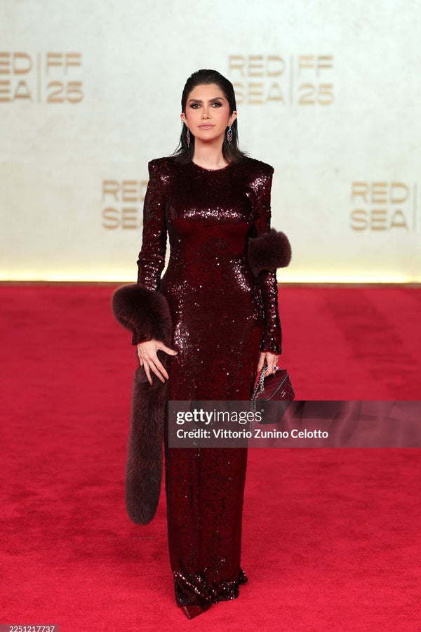 Burgundy sequin gown with fur cape