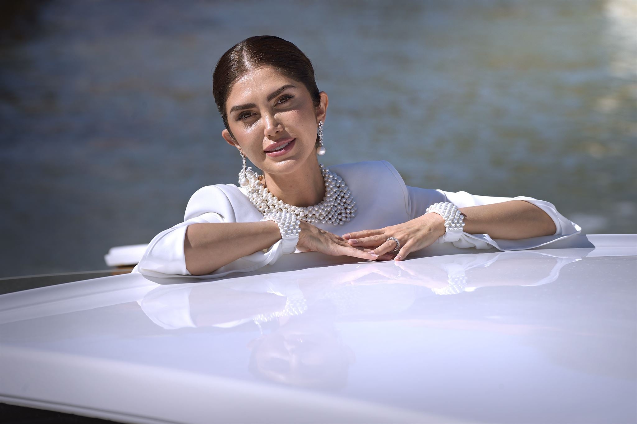 White pearl crop top and column skirt ensemble