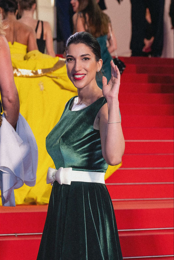 Emerald velvet ivory-bow gown
