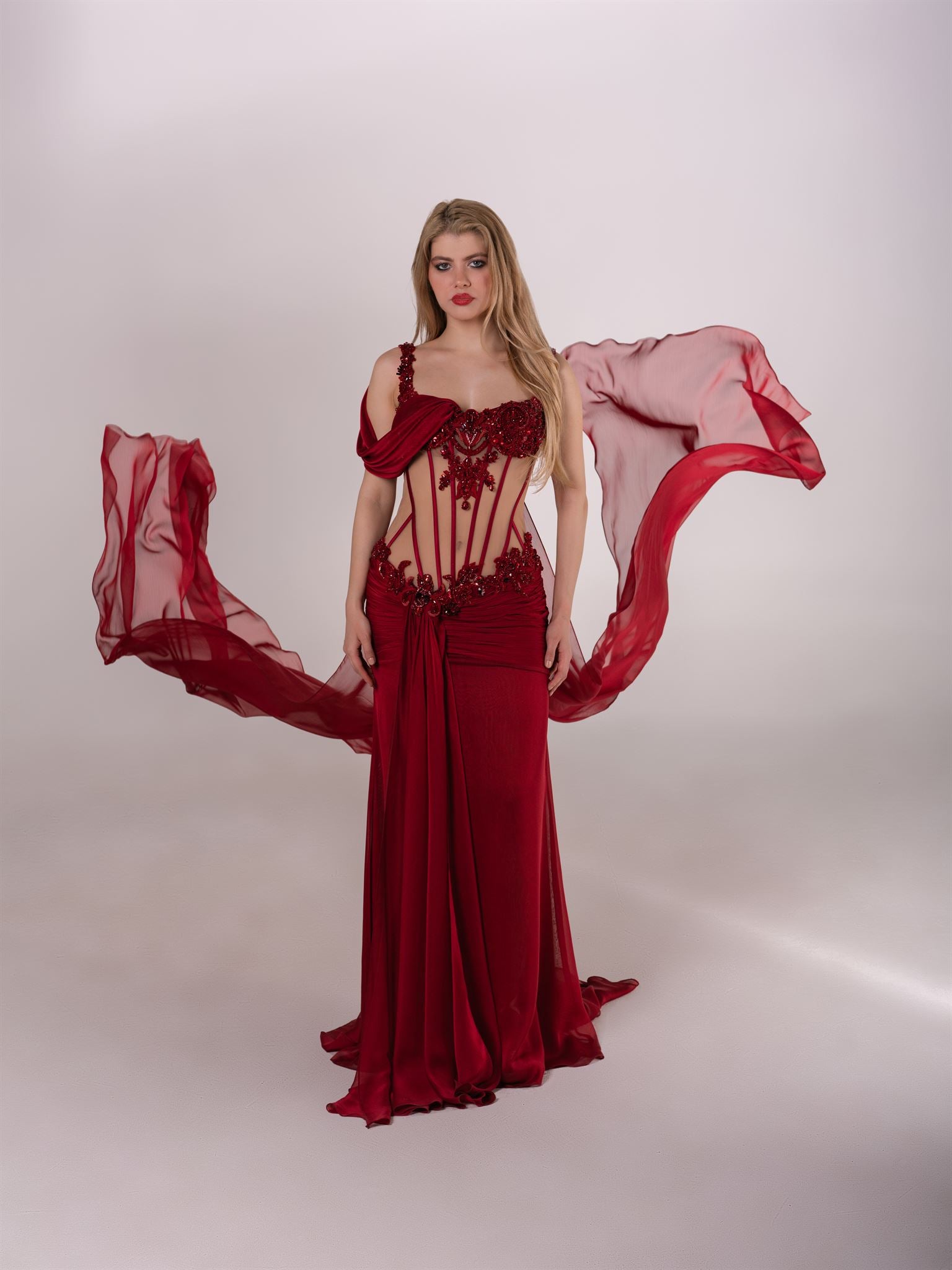Deep red corset draped gown