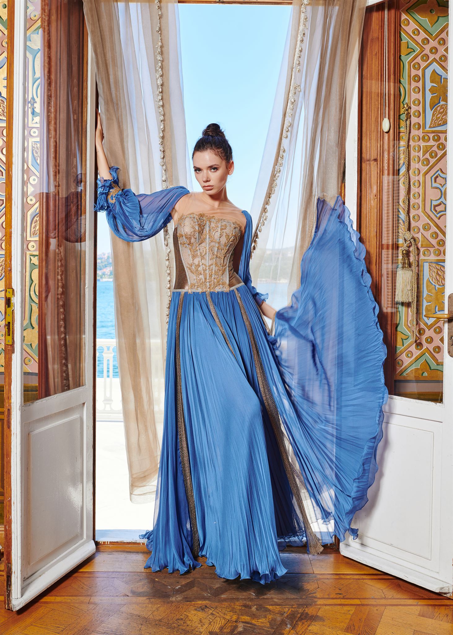Blue gold-appliqué gown