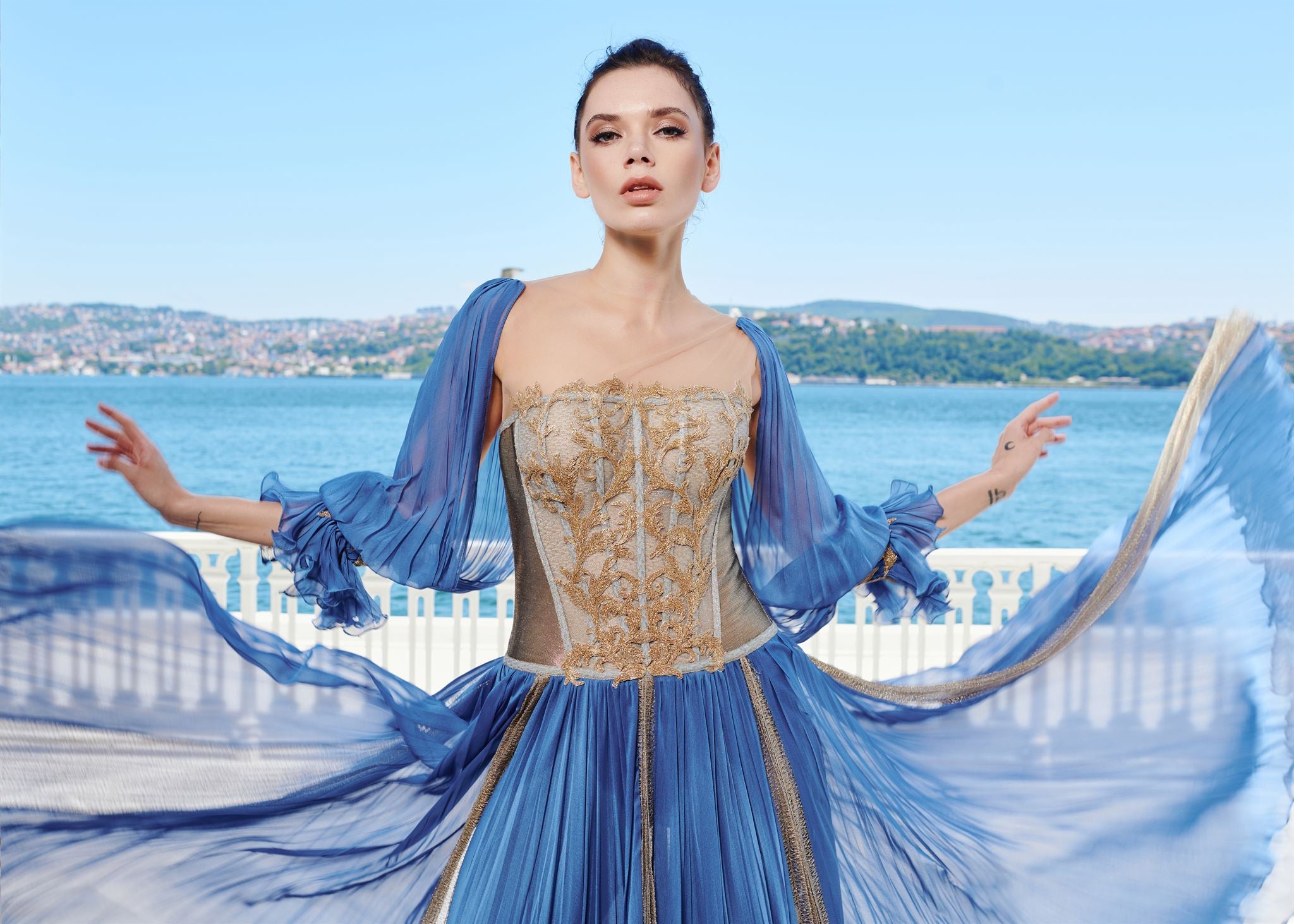 Blue gold-appliqué gown