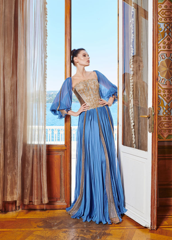 Blue gold-appliqué gown