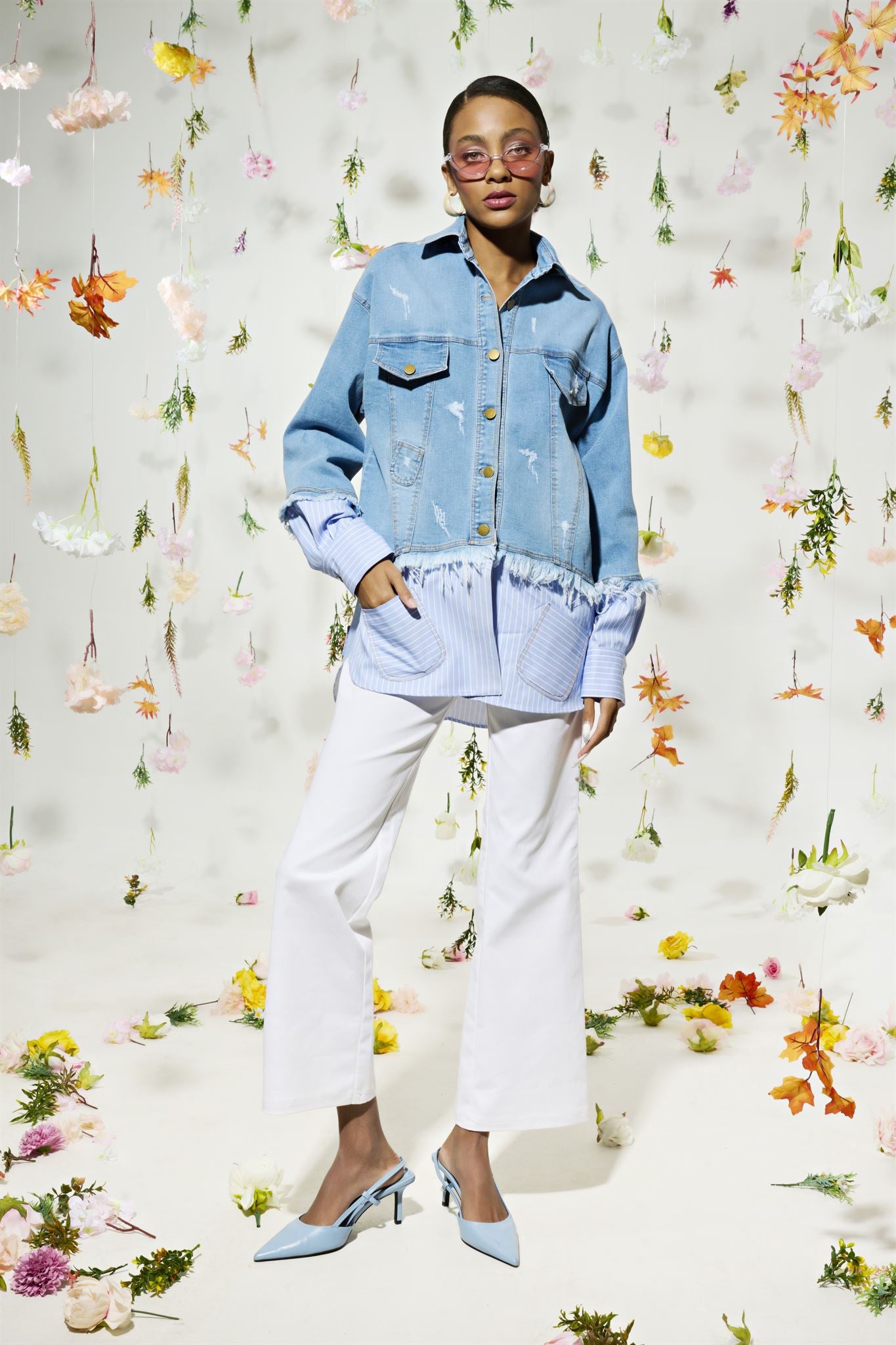 Light blue denim jacket with striped shirt layer