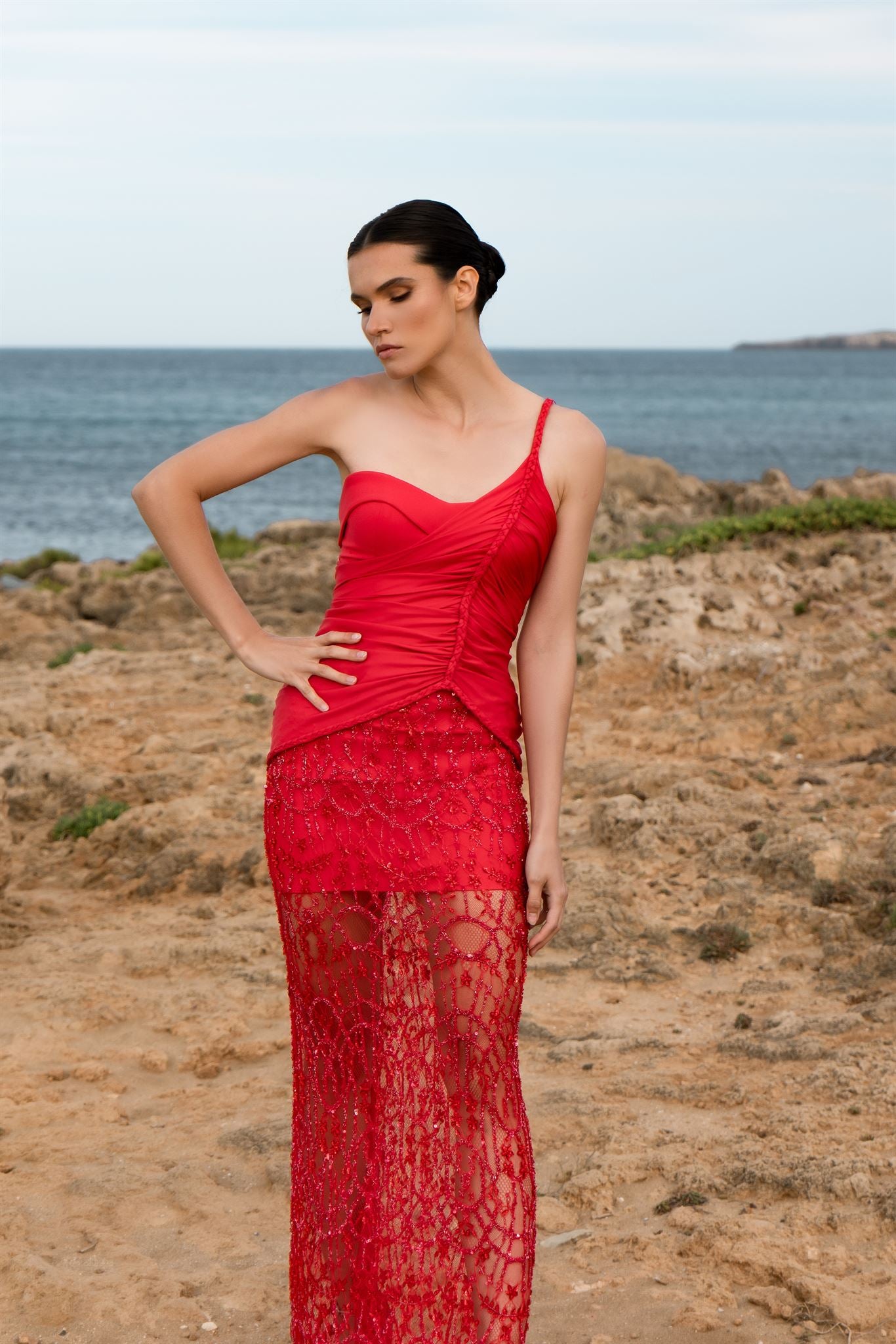 Red one-shoulder braided lace gown