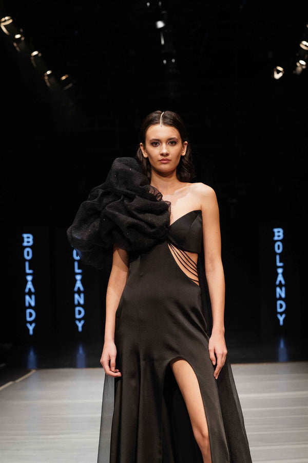 Black one-shoulder ruffle slit gown