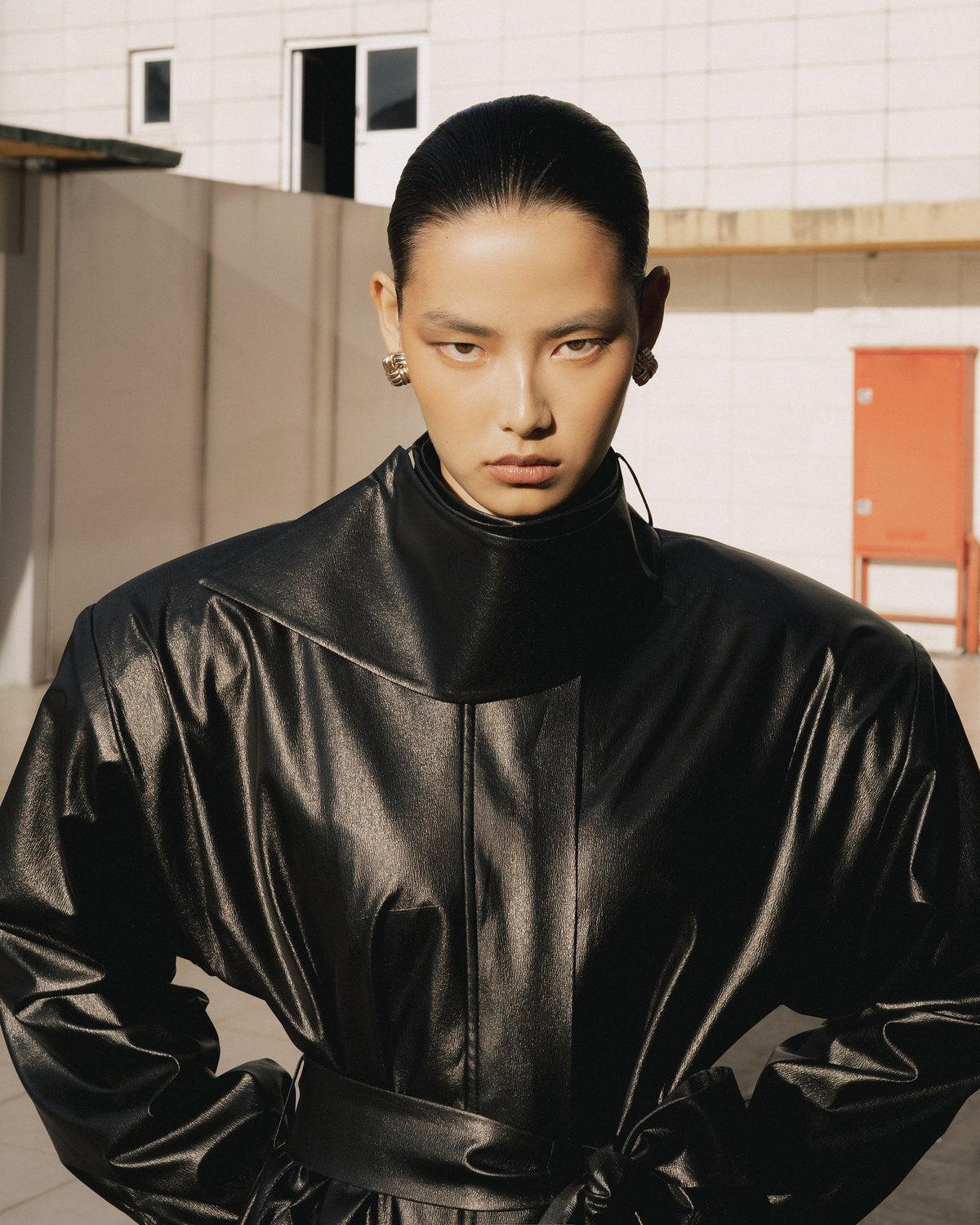 Black leather belted coat